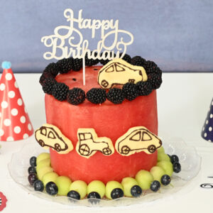 Whimsical Wheels Watermelon Cake